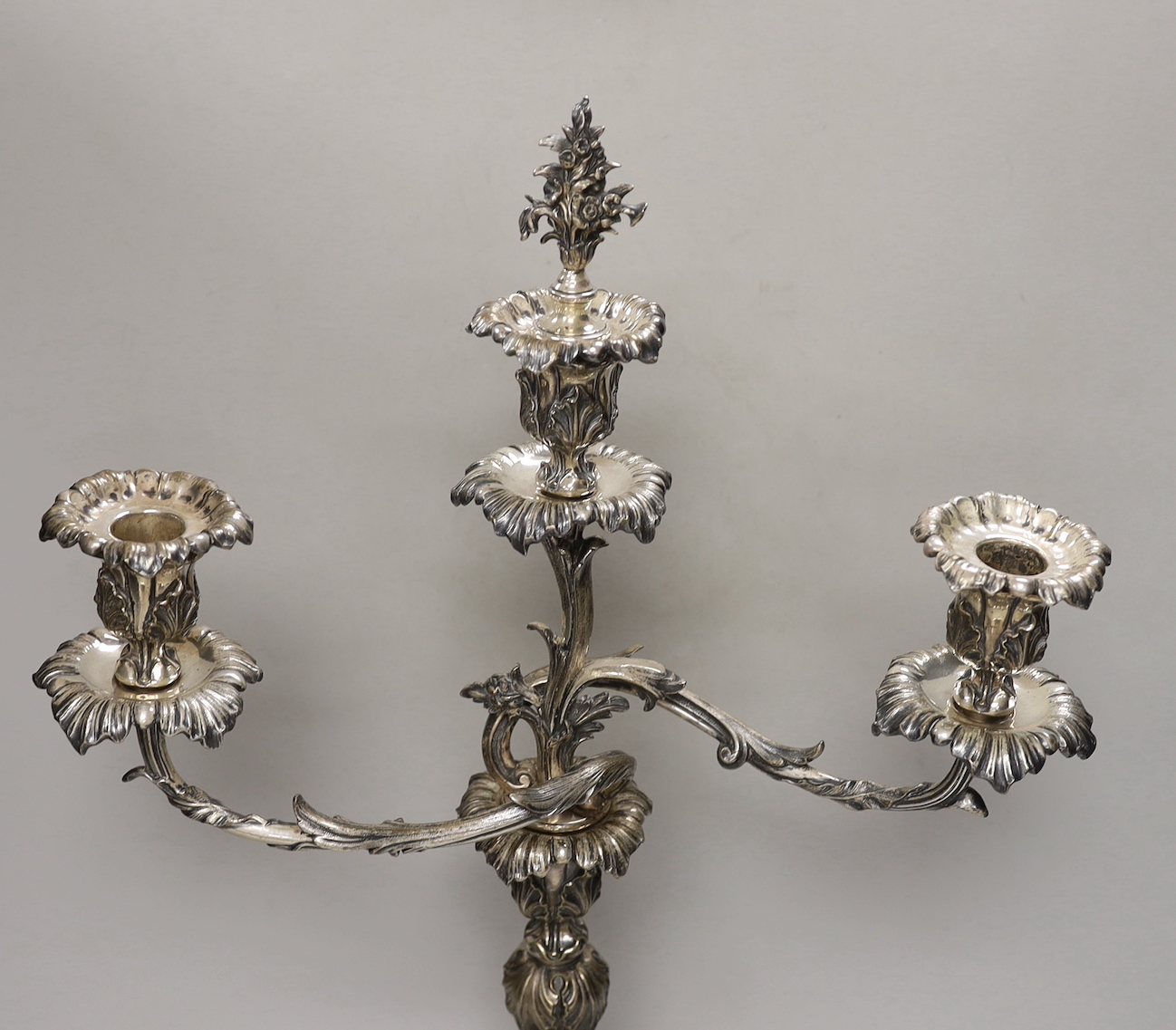 A Victorian plated Elkington & Co two branch, three light candelabrum, 60cm high